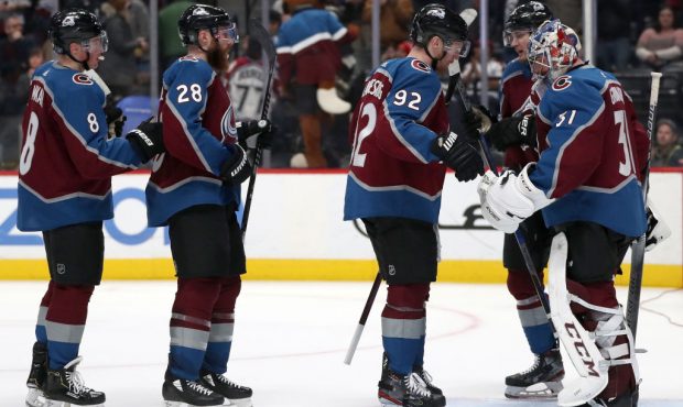 Goalie Philipp Grubauer #31 of the Colorado Avalanche is congratulated by Cale Makar #8, Ian Cole #...