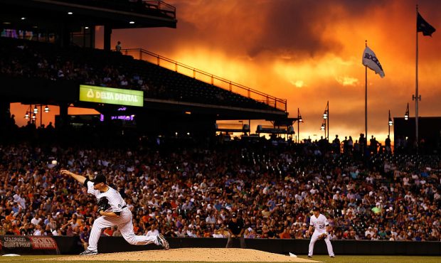 Pitcher Adam Ottavino #37 of the Colorado Rockies delivers against the San Francisco Giants as suns...