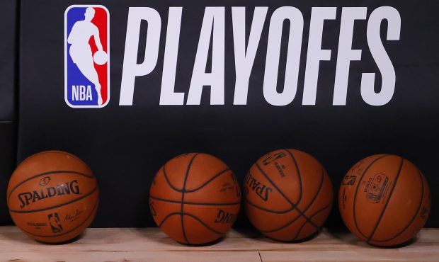 LAKE BUENA VISTA, FLORIDA - AUGUST 17: Basketballs are lined up under the NBA Playoffs logo before ...