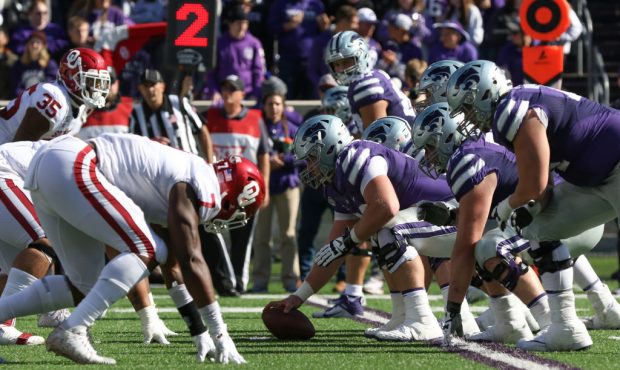 A view of the Kansas State Wildcats offensive line before the snap in the third quarter of a Big 12...