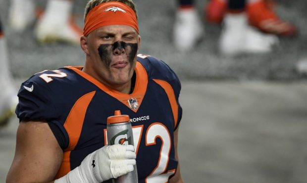 Garett Bolles (72) of the Denver Broncos takes a swig of liquid before the first quarter against th...