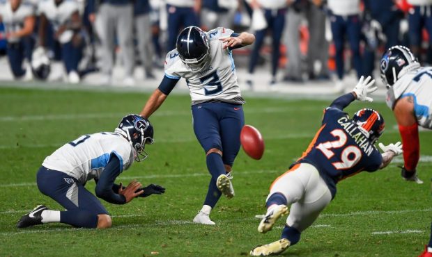 Stephen Gostkowski #3 of the Tennessee Titans kicks a go-ahead fourth quarter field goal as Brett K...