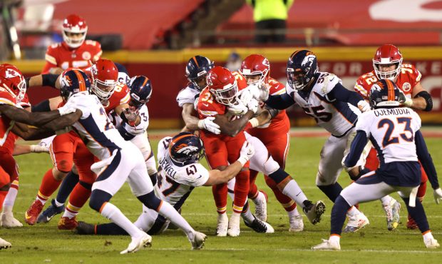 KANSAS CITY, MISSOURI - DECEMBER 06: Darrel Williams #31 of the Kansas City Chiefs rushes against J...