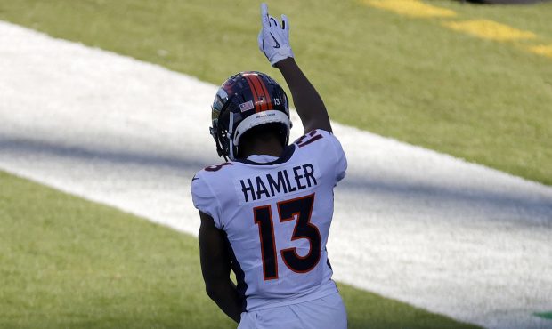 CHARLOTTE, NORTH CAROLINA - DECEMBER 13: P.J. Locke #37 of the Denver Broncos celebrates a 37-yard ...