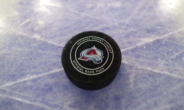 DENVER, CO - JANUARY 4: An official game puck sits on the ice prior to the Colorado Avalanche again...