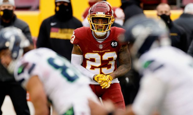 LANDOVER, MARYLAND - DECEMBER 20: Ronald Darby #23 of the Washington Football Team waits for a play...