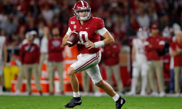 TUSCALOOSA, ALABAMA - OCTOBER 26: Mac Jones #10 of the Alabama Crimson Tide rolls out of the pocket...