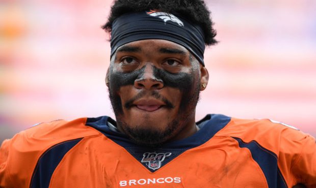 DENVER, CO - SEPTEMBER 15: Elijah Wilkinson (68) of the Denver Broncos catches his breath on the si...
