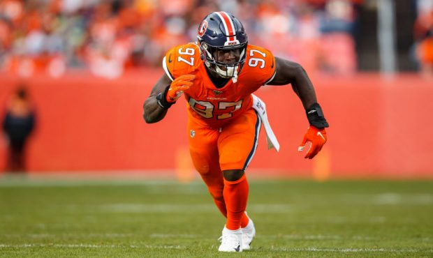 DENVER, CO - DECEMBER 22: Linebacker Jeremiah Attaochu #97 of the Denver Broncos rushes the passer ...