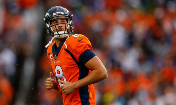 DENVER, CO - SEPTEMBER 17: Kicker Brandon McManus #8 of the Denver Broncos runs off the field after...