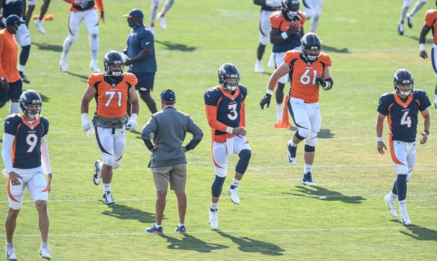 ENGLEWOOD, CO - AUGUST 20: Denver Broncos quarterbacks Jeff Driskel #9, Drew Lock #3, and Brett Ryp...