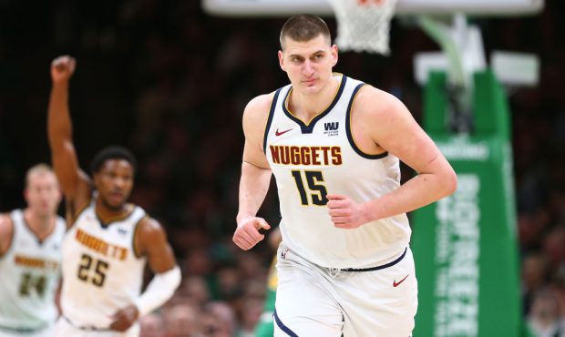BOSTON, MASSACHUSETTS - MARCH 18: Nikola Jokic #15 of the Denver Nuggets celebrates after scoring a...