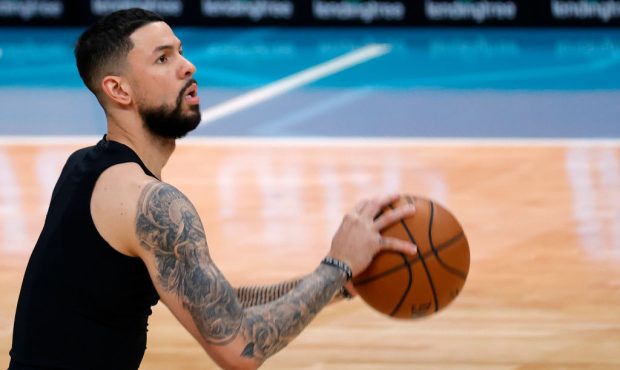 CHARLOTTE, NORTH CAROLINA - JANUARY 11: Austin Rivers #8 of the New York Knicks warms up prior to t...