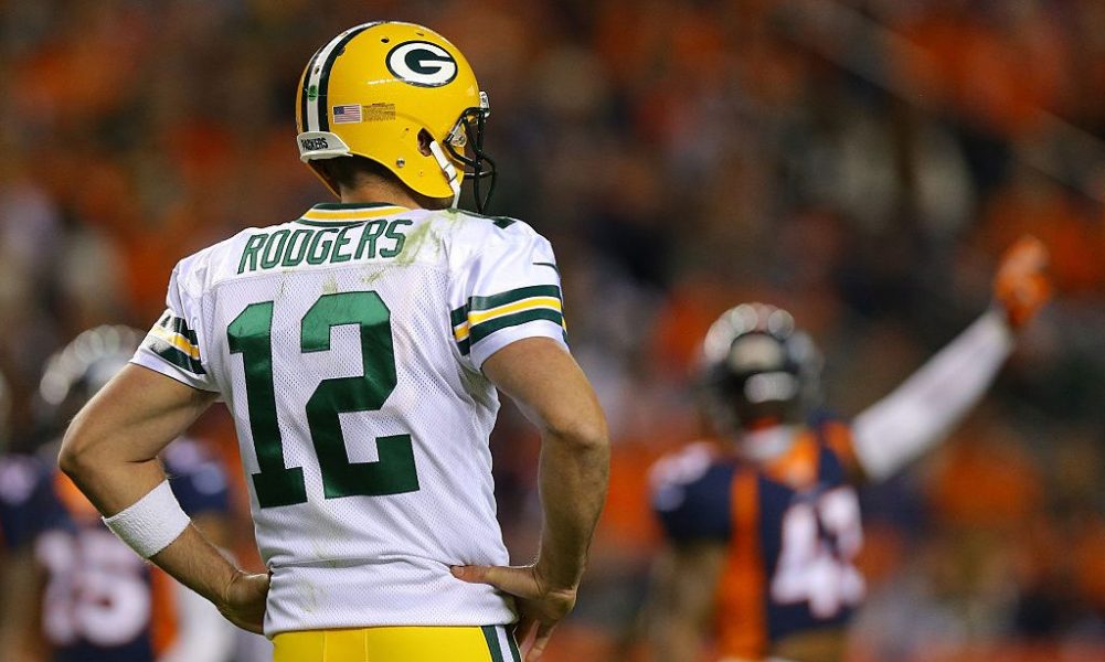 DENVER, CO - NOVEMBER 01: Quarterback Aaron Rodgers #12 of the Green Bay Packers looks on after handing off the ball in the second quarter against the Denver Broncos at Sports Authority Field at Mile High on November 1, 2015 in Denver, Colorado. (Photo by Justin Edmonds/Getty Images)