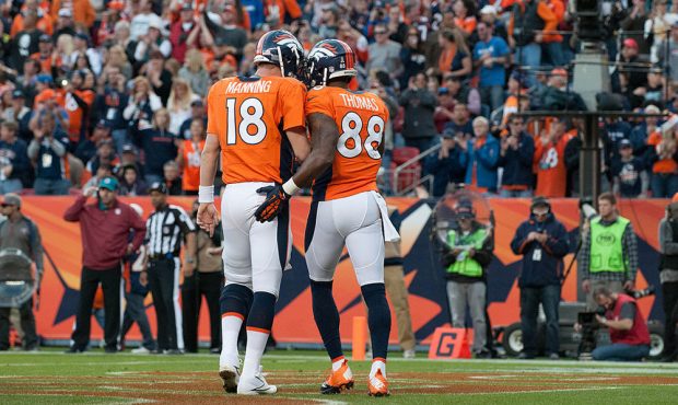 DENVER, CO - DECEMBER 2: Quarterback Peyton Manning #18 and wide receiver Demaryius Thomas #88 of t...