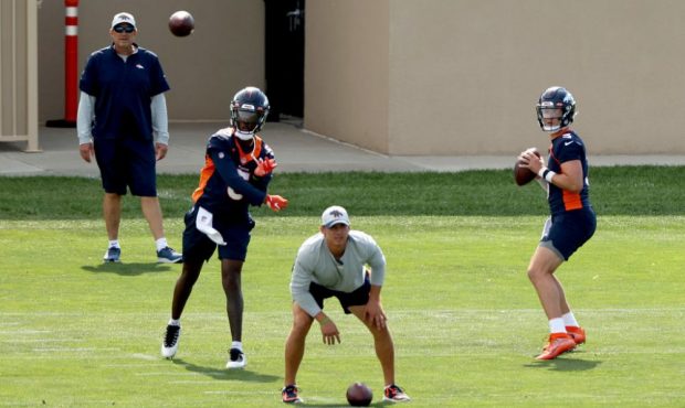 ENGLEWOOD, COLORADO - JULY 30: Quarterbacks Teddy Bridgewater #5 and Drew Lock #3 practice during t...