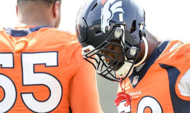 ENGLEWOOD , CO - AUGUST 31: Von Miller (58) and Bradley Chubb (55) of the Denver Broncos warm up du...