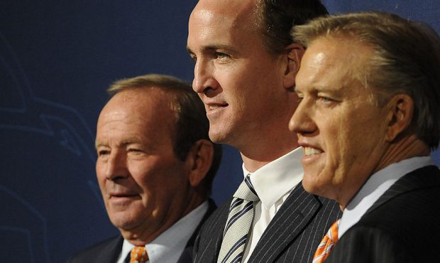 Pat Bowlen, Peyton Manning and John Elway pose for a photo during the Denver Broncos press conferen...