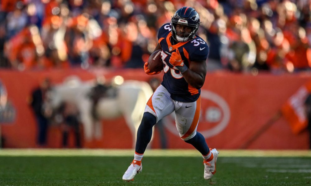 DENVER, CO - OCTOBER 17: Javonte Williams #33 of the Denver Broncos rushes against the Las Vegas Ra...