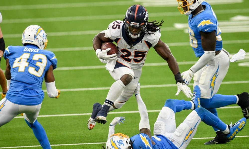 INGLEWOOD, CO - DECEMBER 27: Melvin Gordon III (25) of the Denver Broncos jumps over Jahleel Addae ...