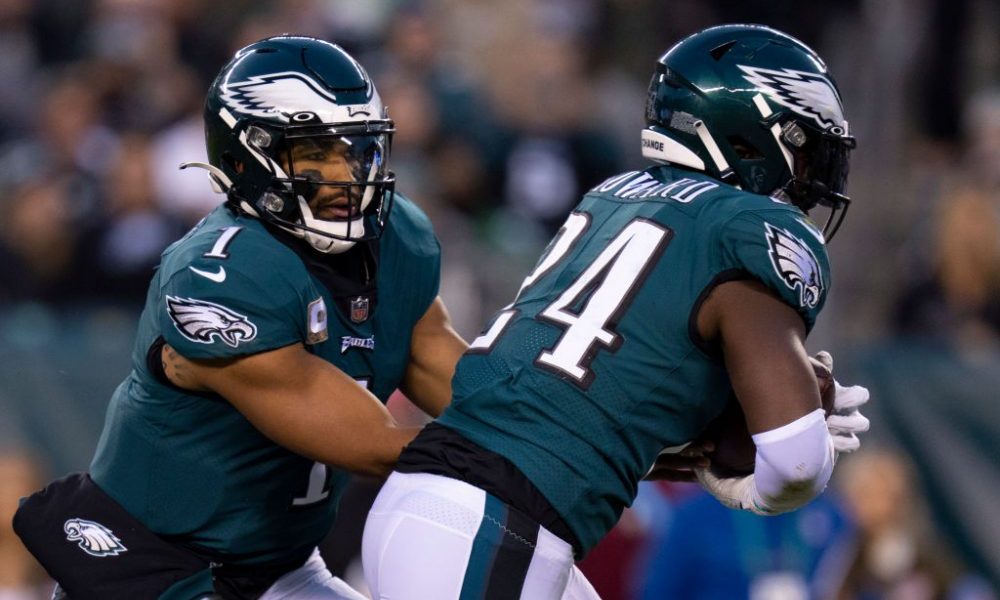 PHILADELPHIA, PA - NOVEMBER 07: Jalen Hurts #1 of the Philadelphia Eagles hands the ball off to Jor...