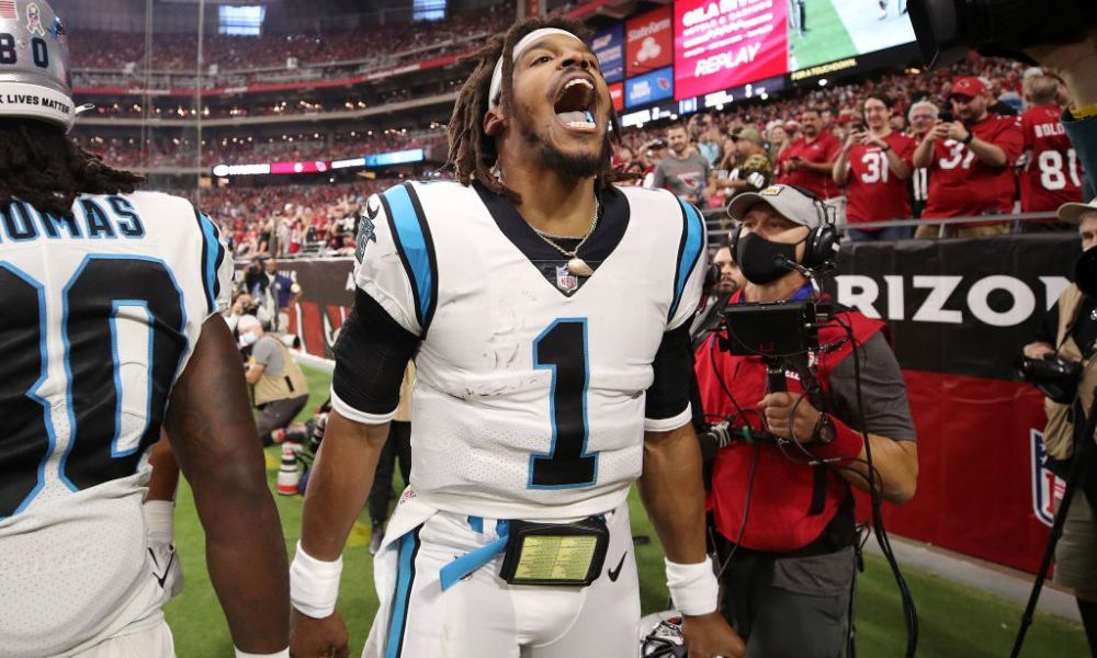 GLENDALE, ARIZONA - NOVEMBER 14: Cam Newton #1 of the Carolina Panthers reacts after scoring on a r...