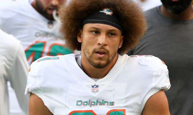 MIAMI GARDENS, FLORIDA - NOVEMBER 28: Phillip Lindsay #31 of the Miami Dolphins walks back to the l...