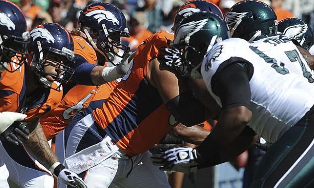 DENVER, CO - SEPTEMBER 29: The Denver Broncos offensive line fires off in the first half. The Denve...