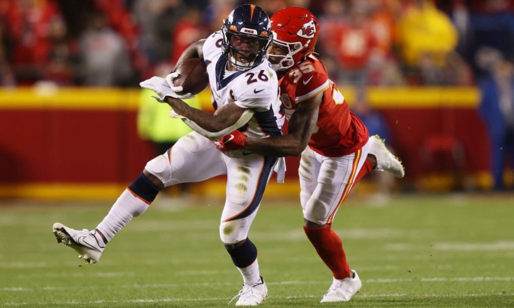 KANSAS CITY, MISSOURI - DECEMBER 05: Mike Boone #26 of the Denver Broncos runs against Charvarius W...