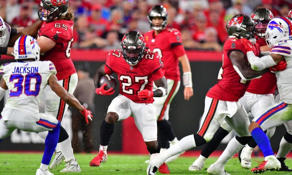 TAMPA, FLORIDA - DECEMBER 12: Ronald Jones #27 of the Tampa Bay Buccaneers runs with the ball again...