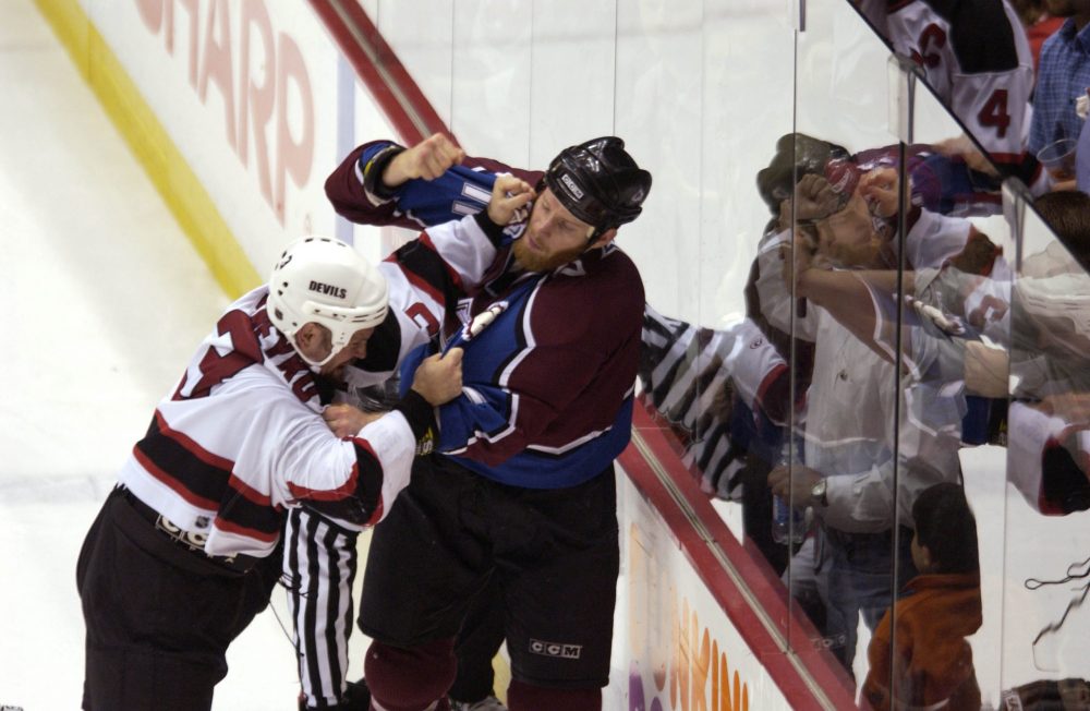7Jun 2001:  Ken Daneyko #3 of the New Jersey Devils fights with Chris Dingman #11 of the Colorado A...