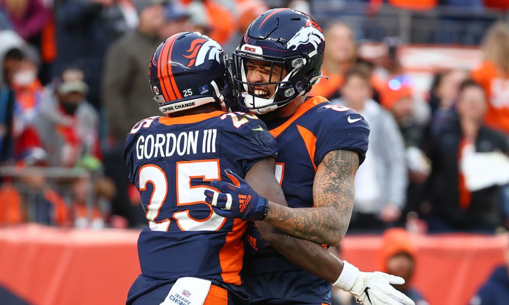 DENVER, COLORADO - JANUARY 08: Melvin Gordon #25 of the Denver Broncos celebrates with Tim Patrick ...