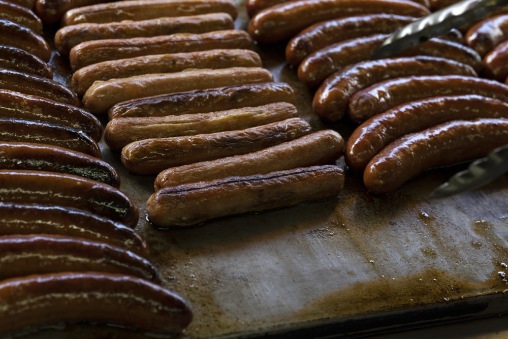 WASHINGTON, DC - AUGUST 22: Beef and turkey hot dogs are grilled before being served at Ben's Chili...