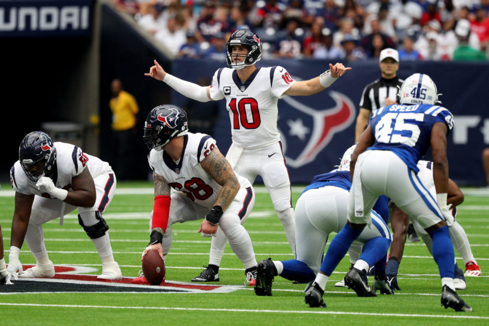 HOUSTON, TEXAS - SEPTEMBER 11: Davis Mills #10 of the Houston Texans communicates at the line of sc...