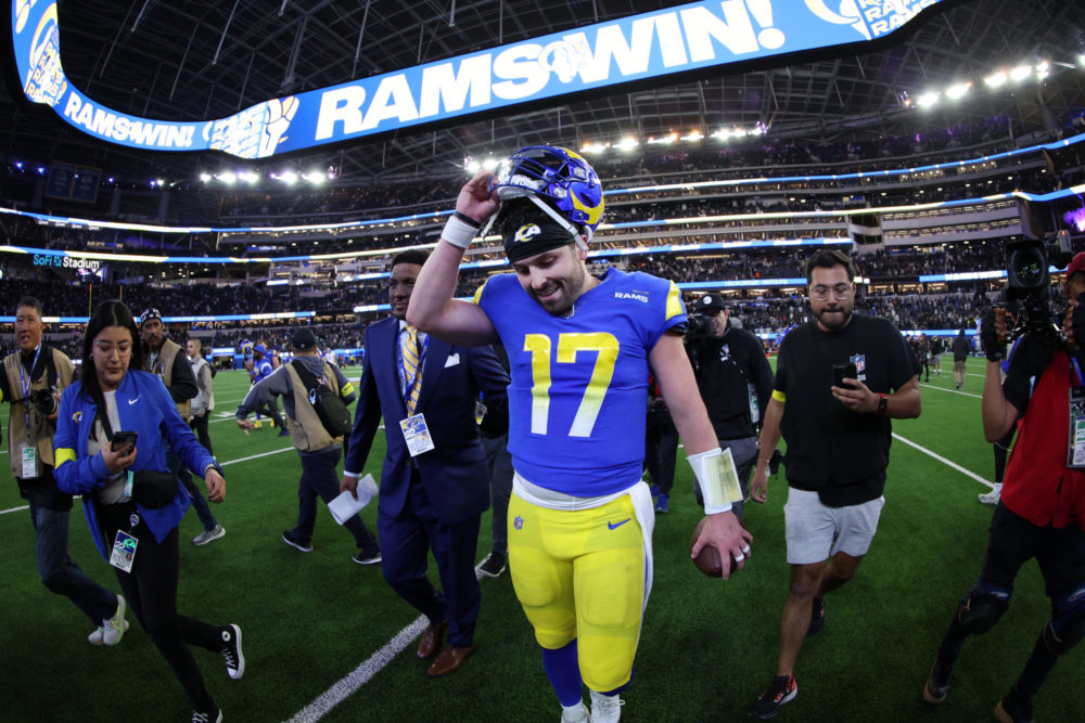 INGLEWOOD, CALIFORNIA - DECEMBER 08: Baker Mayfield #17 of the Los Angeles Rams celebrates after hi...