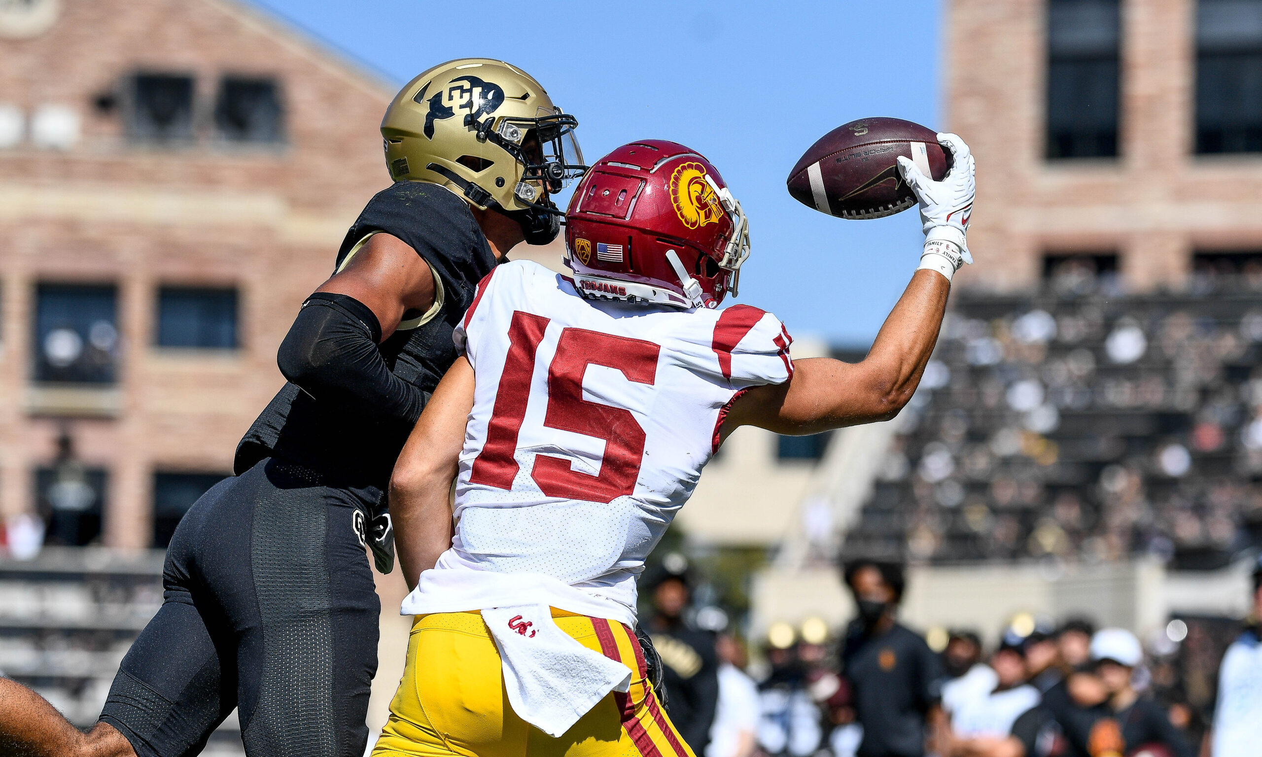 Wide receiver Drake London #15 of the USC Trojans has a touchdown reception under coverage by corne...