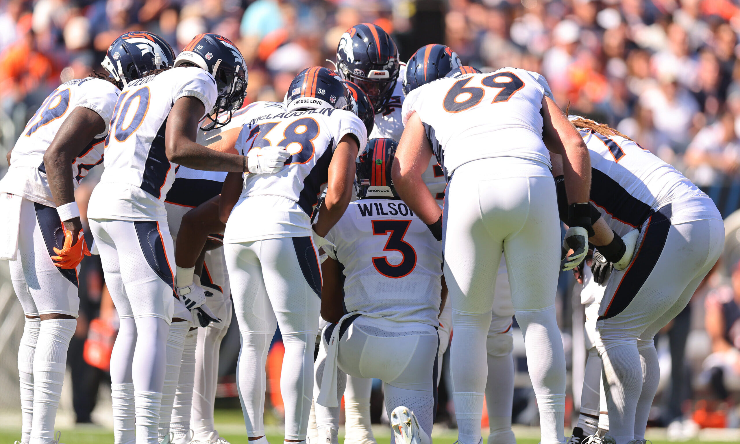 Broncos huddle...