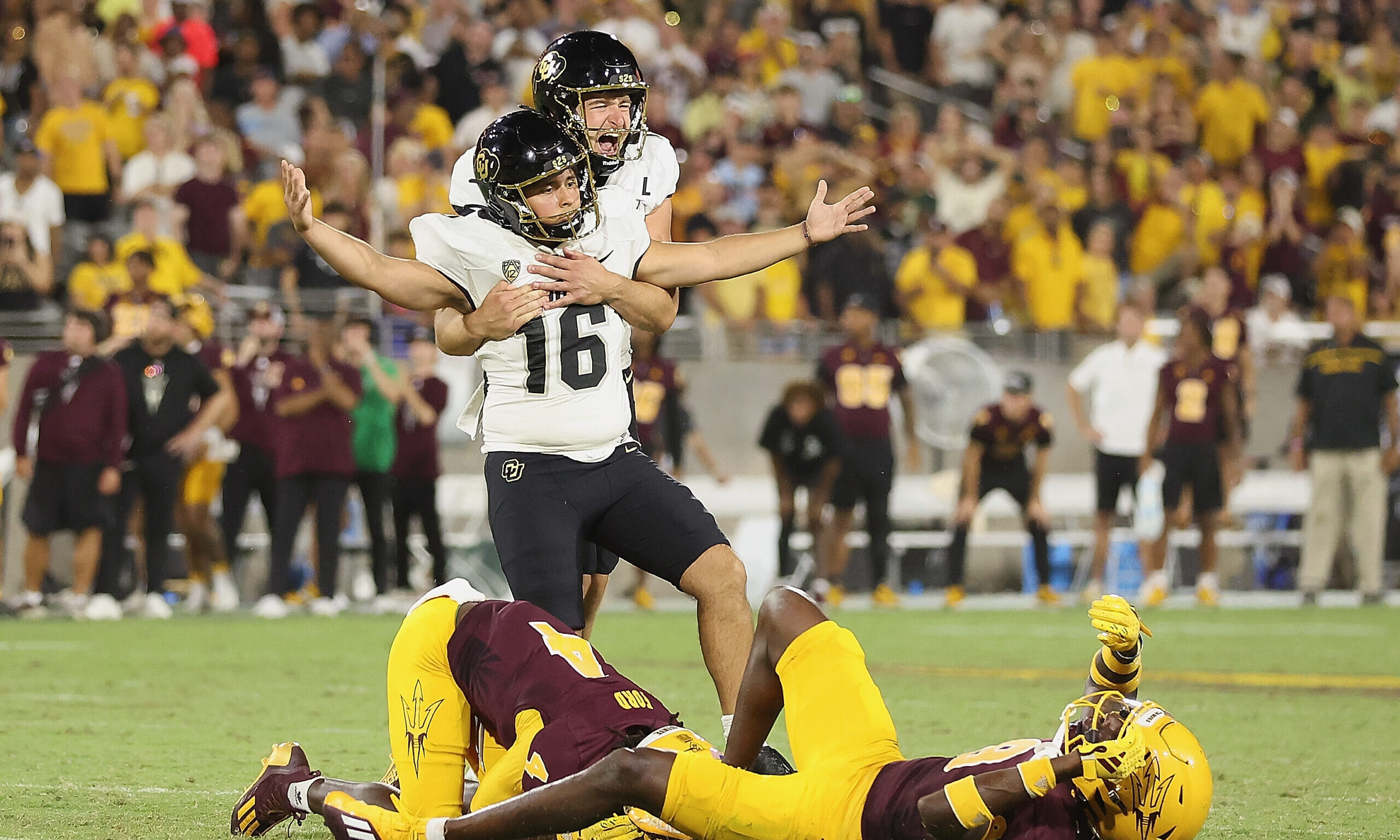Place kicker Alejandro Mata #16 of the Colorado Buffaloes...