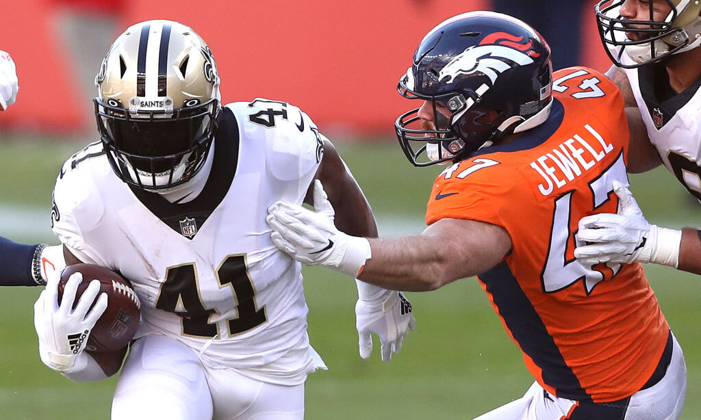 Alvin Kamara #41 of the New Orleans Saints rushes against Josey Jewell #47 of the Denver Broncos du...