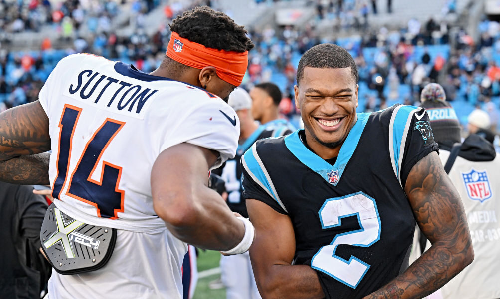 NOVEMBER 27: DJ Moore #2 of the Carolina Panthers and Courtland Sutton #14 of the Denver Broncos ta...