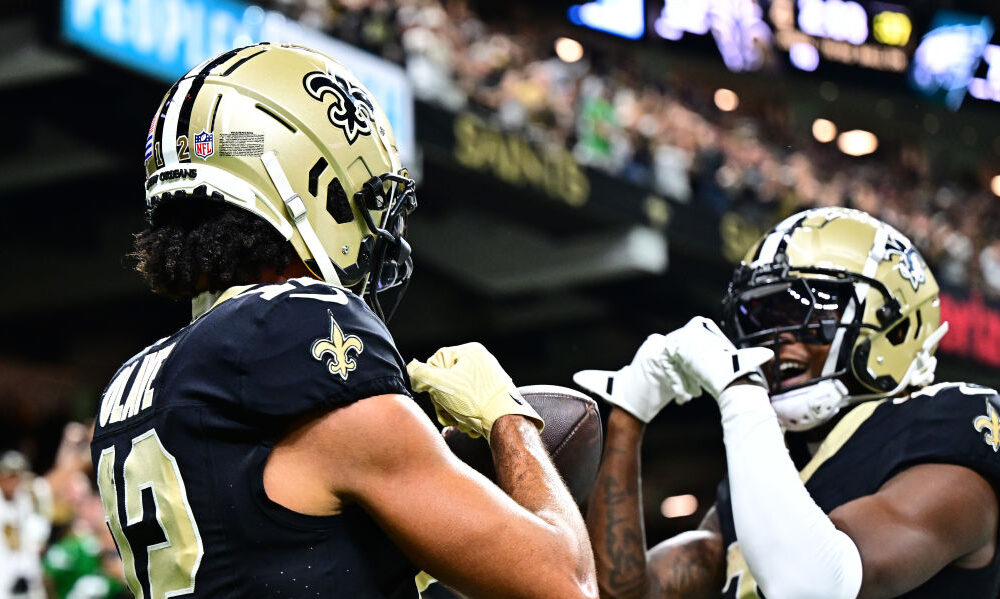 Chris Olave #12 of the New Orleans Saints celebrates a touchdown reception with Rashid Shaheed #22 ...